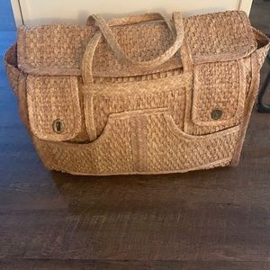 1970’s vintage straw weekend bag w/ front pockets.  Spacious and lightweight.